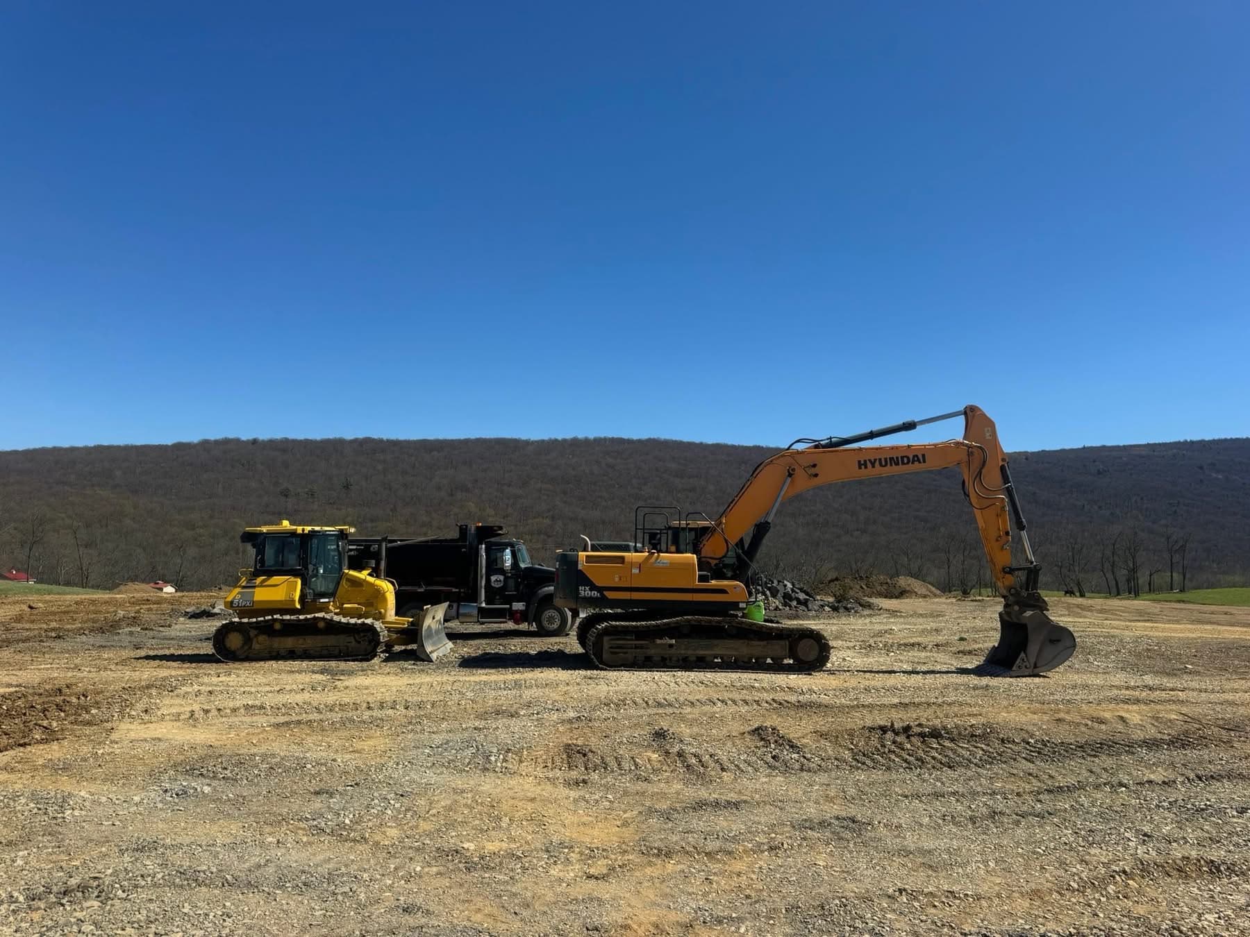 EW Wise dozer, dump truck, and excavator at a Bedford County PA site